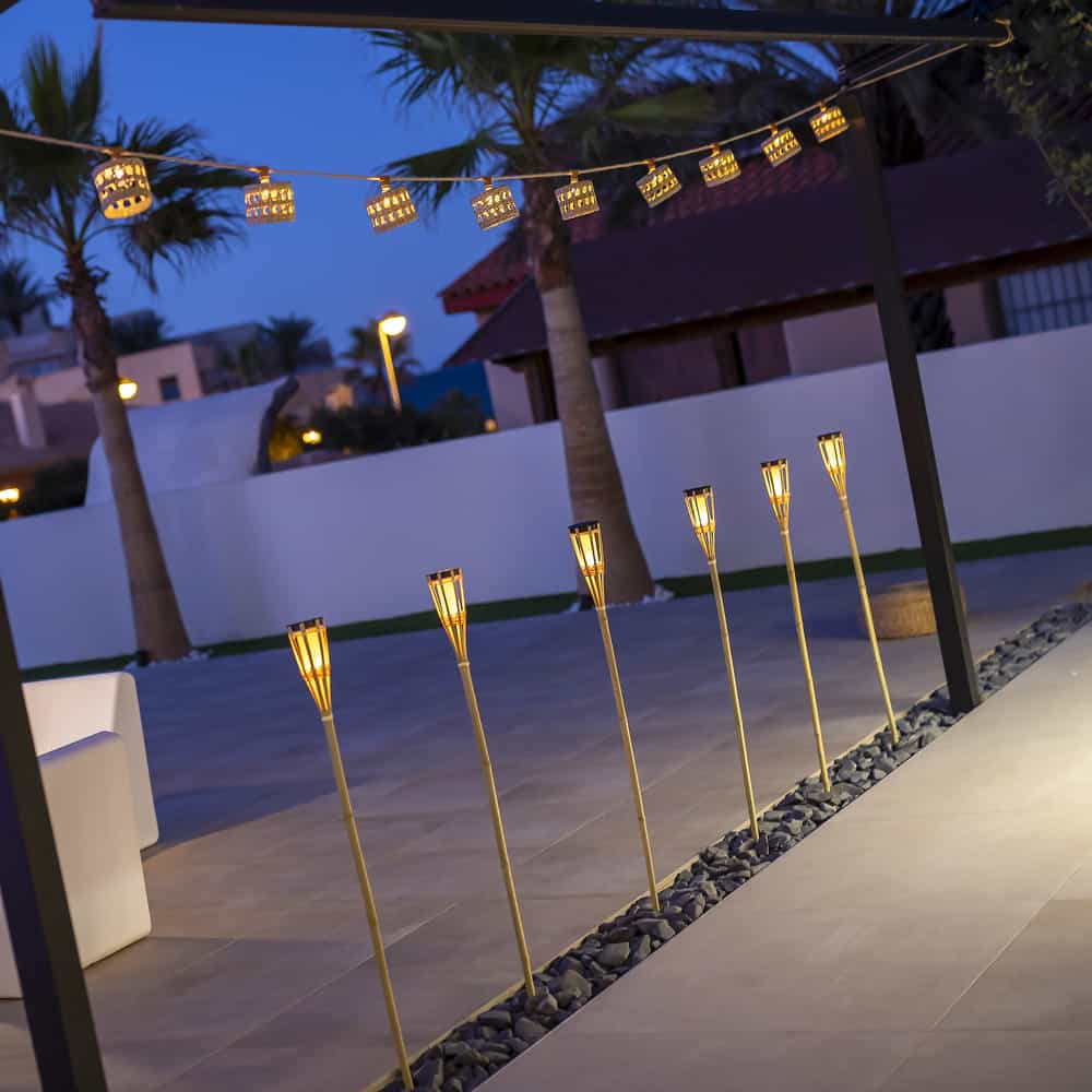 Experience eco-friendly outdoor lighting with Newgarden's Hiama, a handcrafted bamboo garden spike with an LED module.