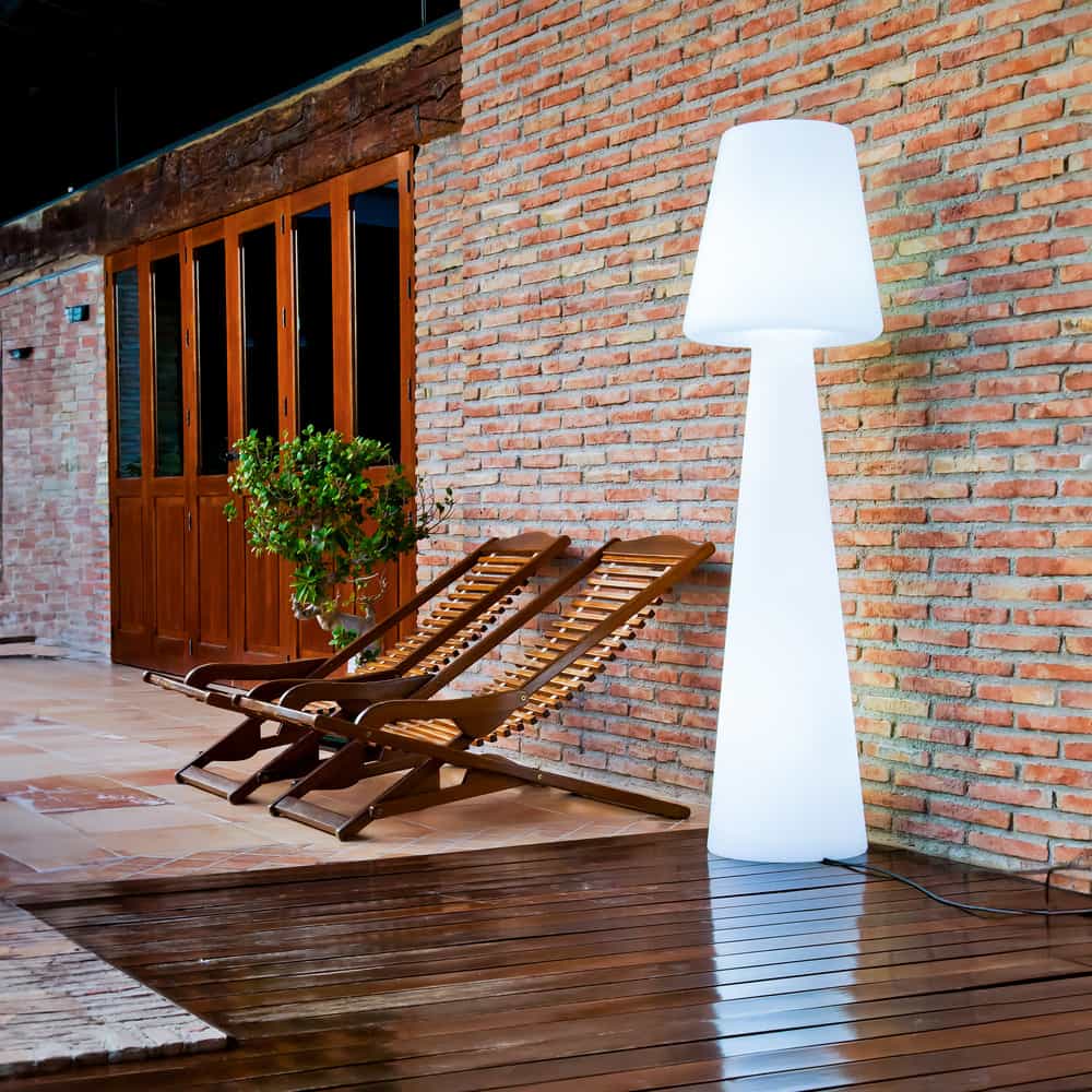 Newgarden's Lola 165: An indoor/outdoor floor luminaire, blending modern materials, advanced tech, and evocative design.