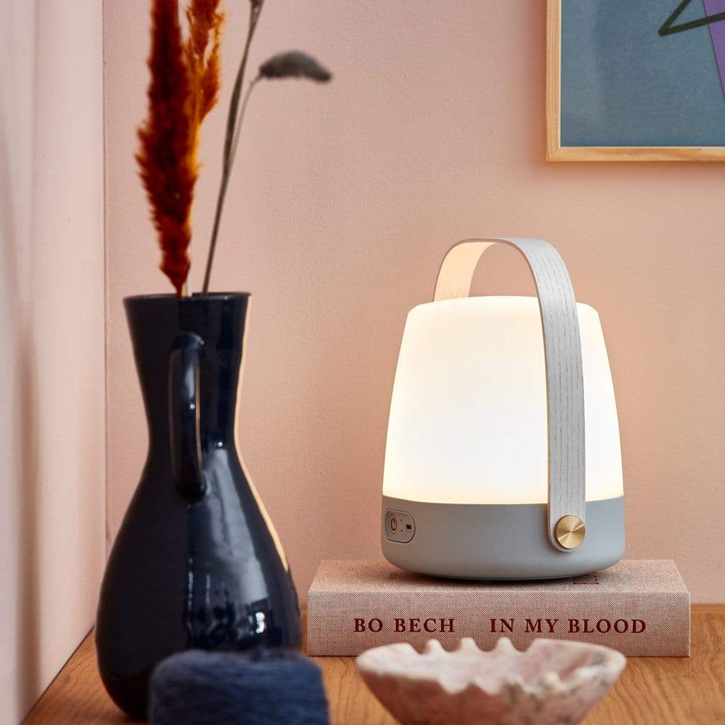 Elevate your interior with the Danish-designed Kooduu Lite-up LED lamp. With its dimmable LED light and portable rechargeable battery, it's perfect for creating a cozy atmosphere in any room.